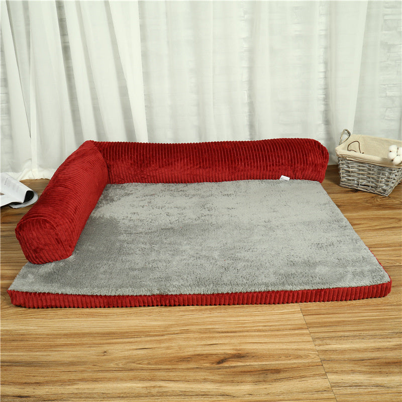 Red and gray pet bed on a wooden floor with white curtains in the background