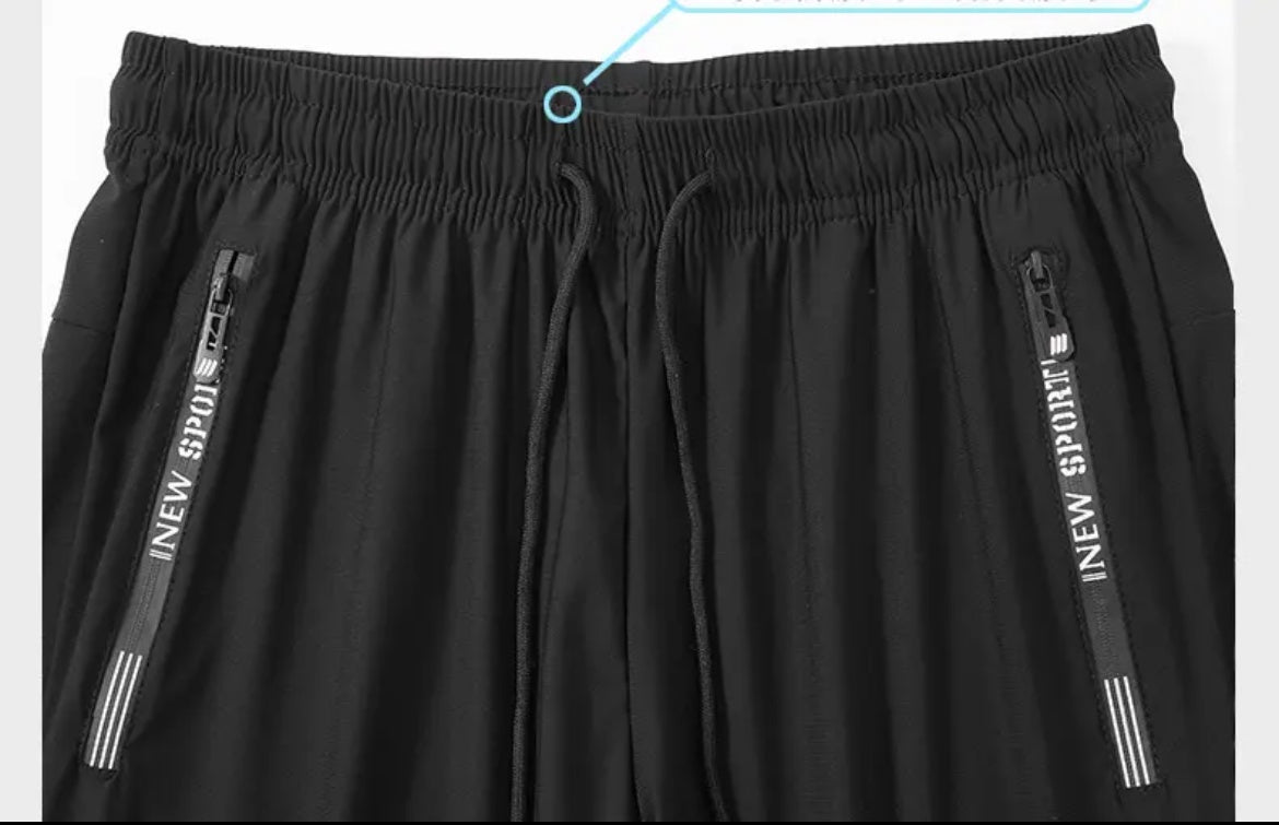 Black shorts with 'INNEW SPORT' branding on a white background